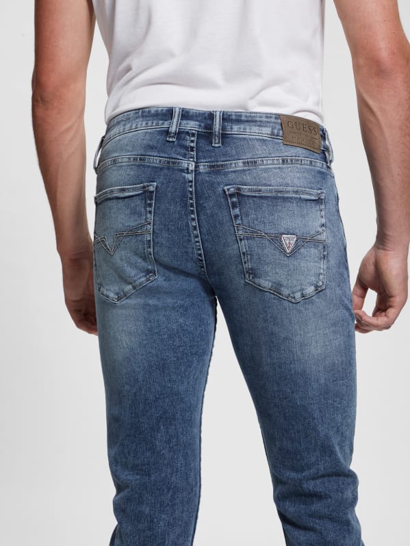 GUESS Slim Tapered Jeans In Dusty Indigo Destroy Wash, $128, GUESS