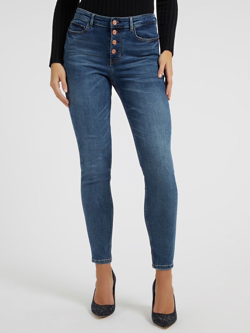 Skinny denim broek zichtbare knoop