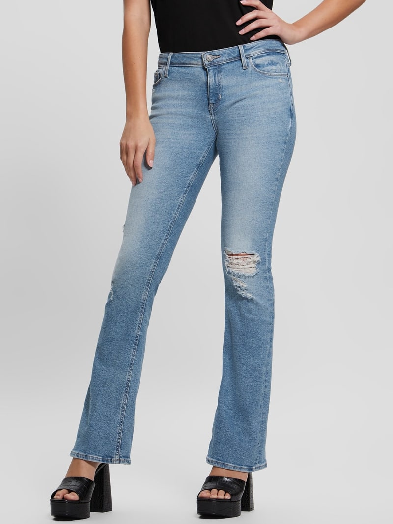 Расклешенные рваные джинсы