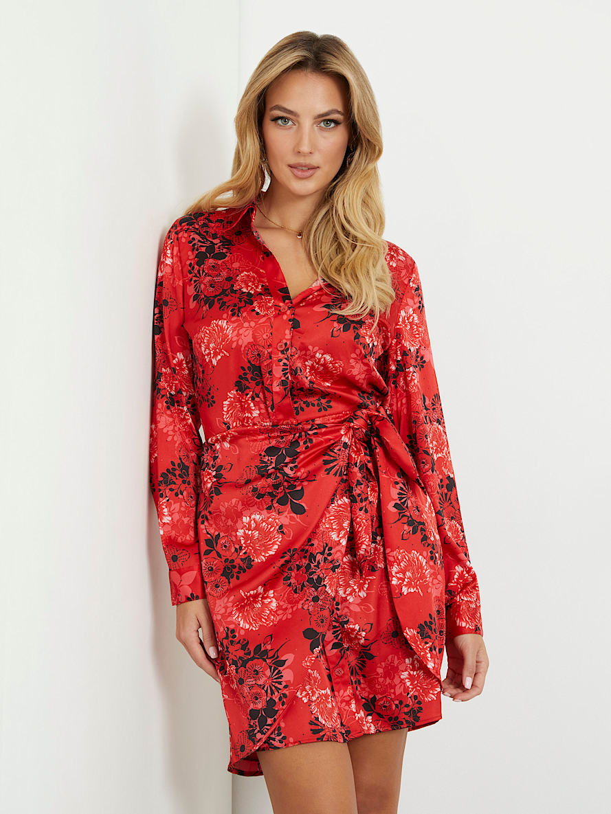 Model wearing Guess’ red floral dress on a white background