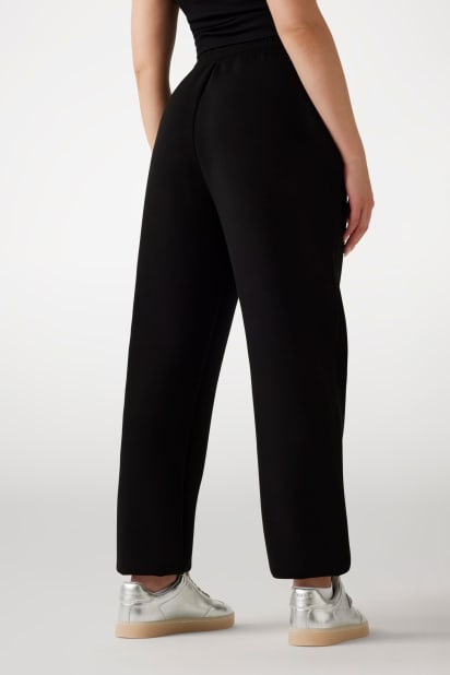 GUESS® Rhinestone logolu jogger pantolonlar Kadın