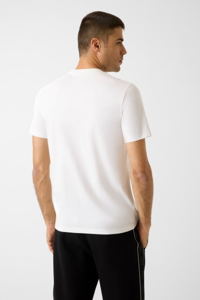 GUESS® Baskılı logolu tişört Erkek