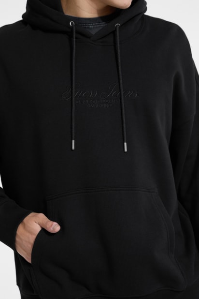 【ブラック(BLK)】GUESS パーカー (M)Embroidered Snap Hoodie ブラック(BLK)】GUESS パーカー (M)Embroidered Snap Hoodie 【公式通販】