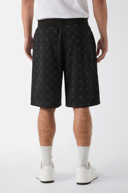GUESS® All over logo shorts