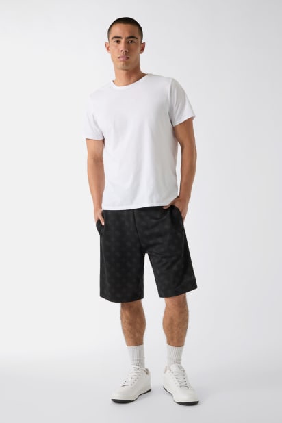 GUESS® All over logo shorts