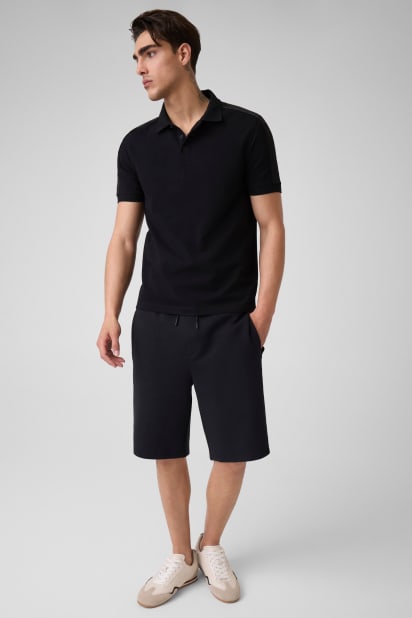 GUESS® Logo polo shirt