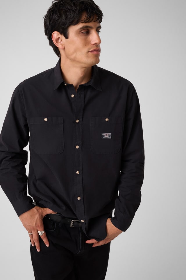 Camisa de mangas compridas com bolsos