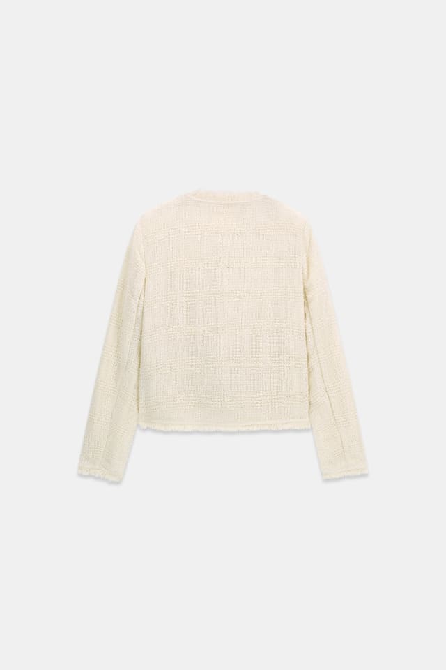 Chaqueta de tweed con flecos