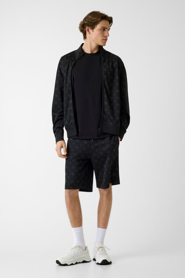 Shorts con logo all over