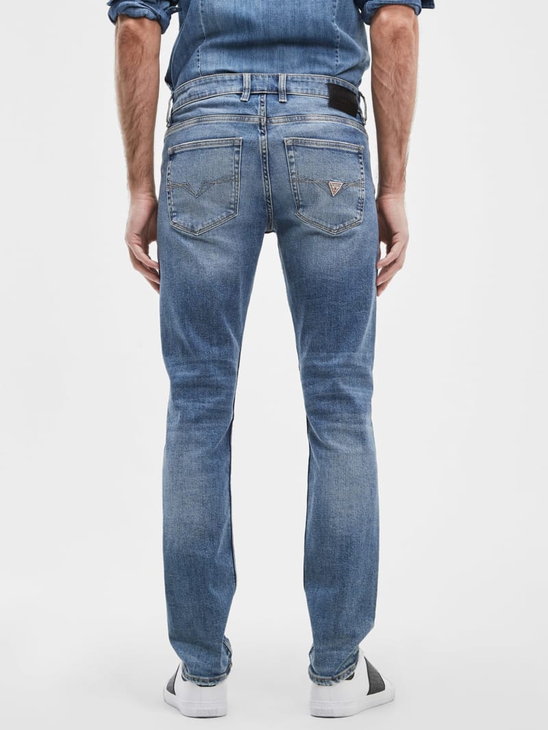 Guess Distressed Slim Tapered Jeans. 4